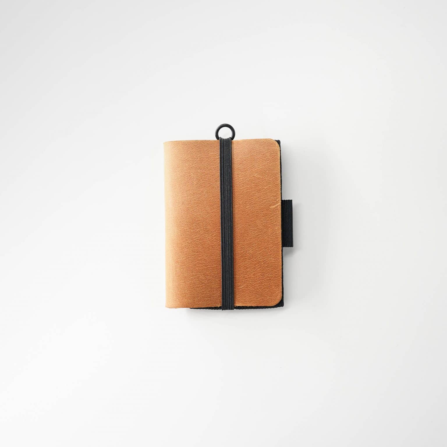 Minimalist leather wallet with innovative pull-tab design.