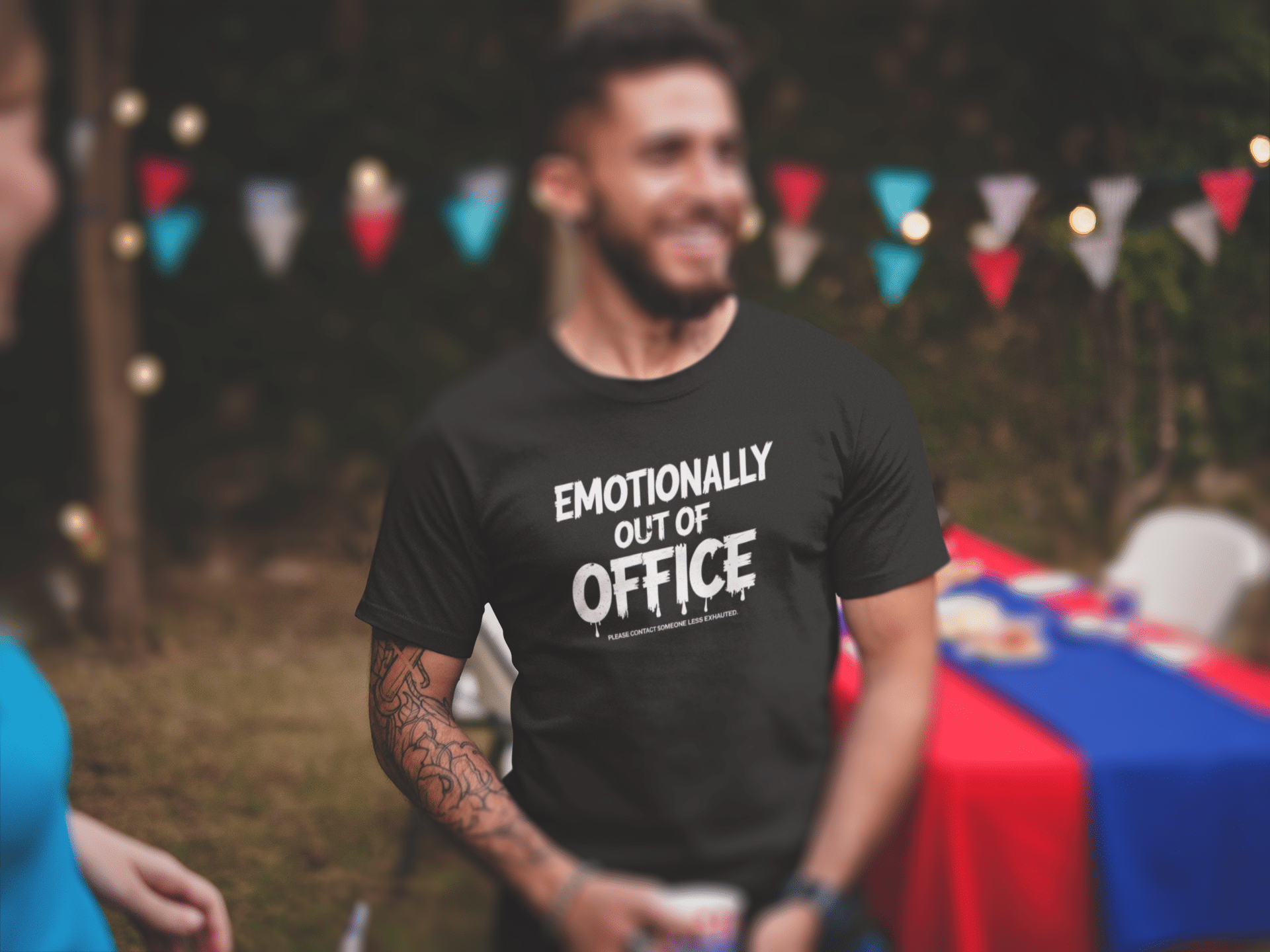 smiling man wearing a tshirt mockup at a 4th of july bbq a20840 - FOCX